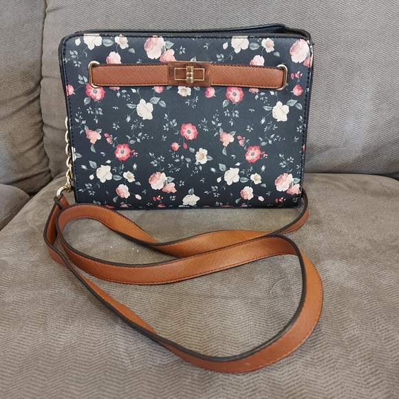 Black crossbody purse with red and white floral pattern and brown strap - Picture 1 of 4